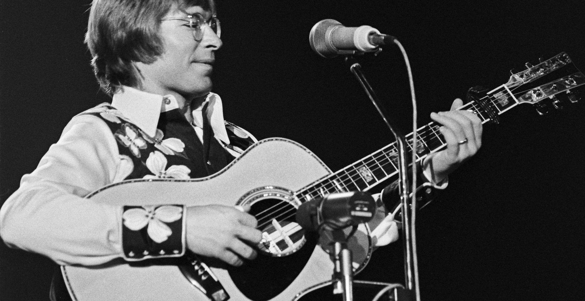 John Denver performing live