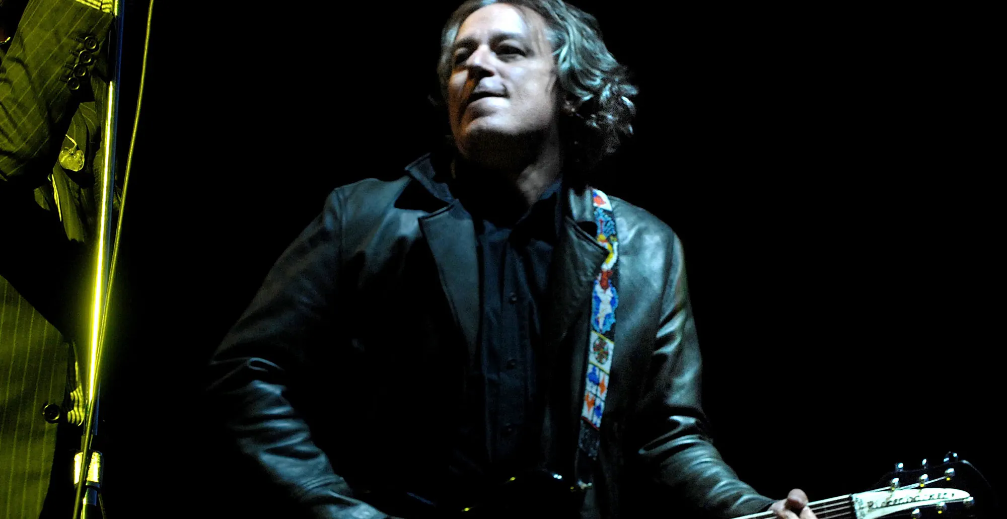 Peter Buck live onstage with R.E.M