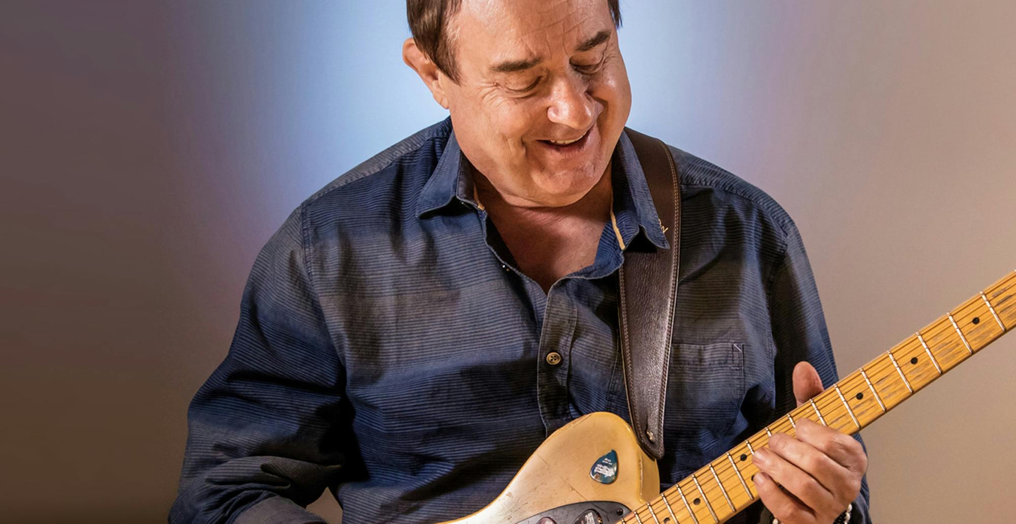 Steve Trovato playing the guitar.